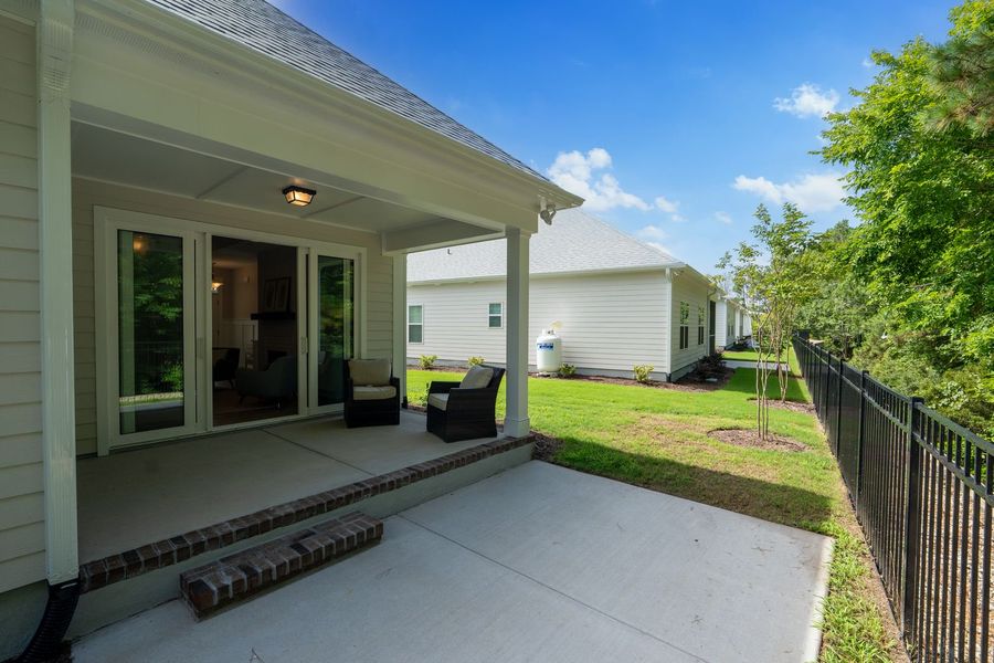 Front exterior of a new home in The Sanctuary at Sunset Beach, Sunset Beach, NC, highlighting curb appeal (Image 28).