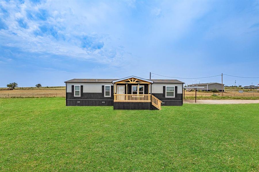 Front exterior of a new home in , Decatur, TX, highlighting curb appeal (Image 22). Front exterior of a new home in , Decatur, TX, highlighting curb appeal (Image 22).