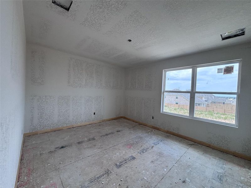 Spacious, unfurnished interior of a new home in The Colony 45s, Bastrop (Image 17).