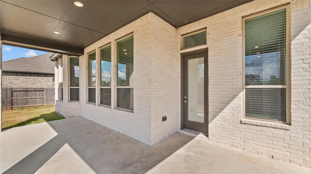 Exterior details and patio area of a home in , Conroe (Image 3). Exterior details and patio area of a home in , Conroe (Image 3).