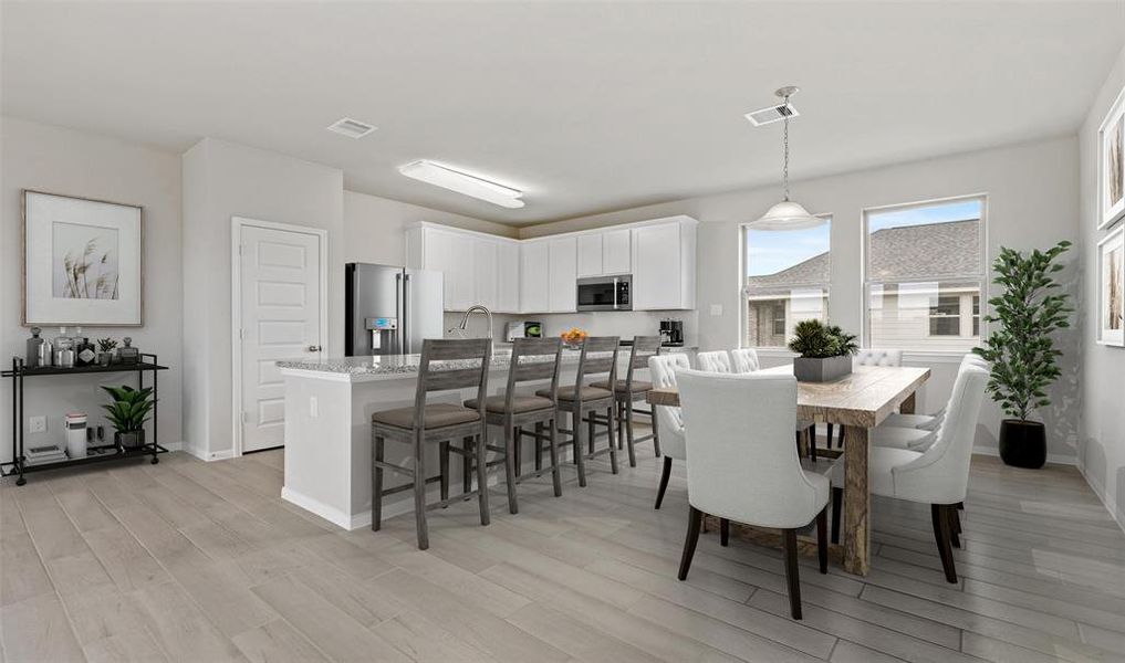 View of kitchen and dining area (*Photo not of actual home and used for illustration purposes only.)