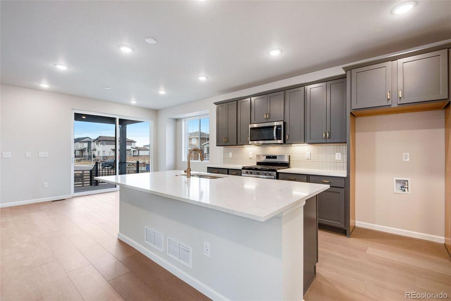 Furnished interior view inside a new home in Painted Prairie, Aurora (Image 6).