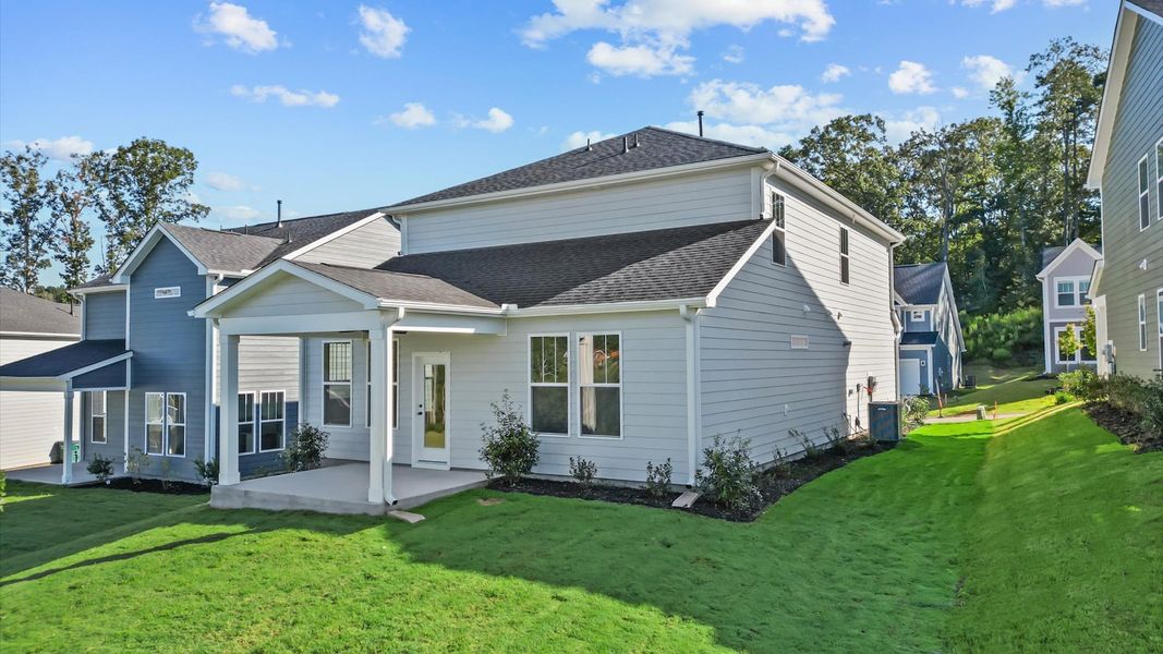 Superior curb appeal continues to the back with a refined, covered outdoor living space