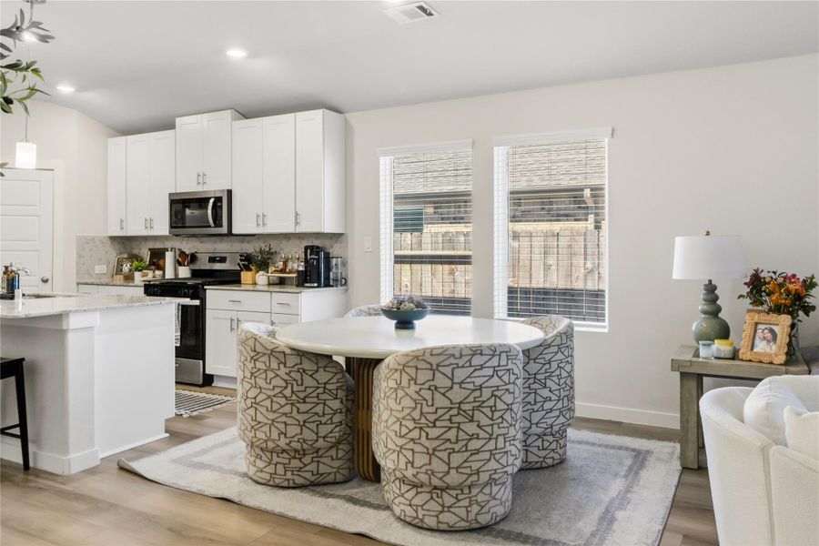 Furnished interior view inside a new home in Heights of Barbers Hill, Mont Belvieu (Image 11).