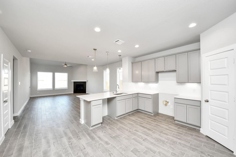 This generously spacious kitchen is a dream realized! Sample photo of completed home with similar floor plan. Actual colors and selections may vary.