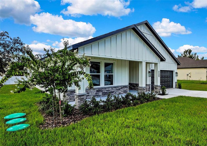 Front exterior of a new home in , Spring Hill, FL, highlighting curb appeal (Image 27).
