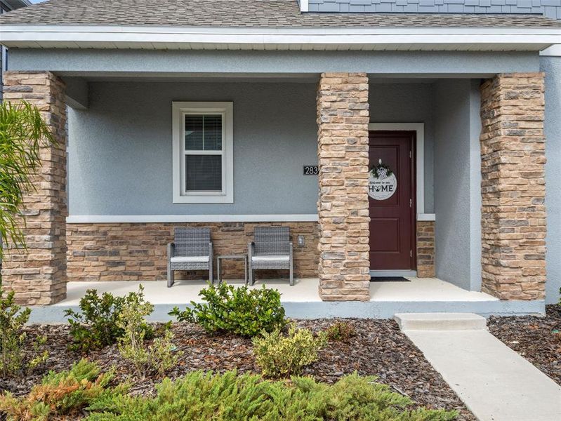 Exterior details and patio area of a home in Wellness Ridge, Clermont (Image 3).