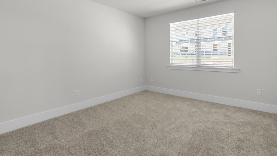 Spacious, unfurnished interior of a new home in Surfside Landing, Hubert (Image 15).