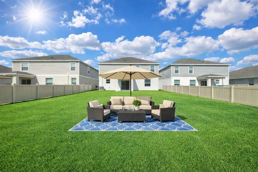 Exterior details and patio area of a home in Broadleaf, Parrish (Image 4).