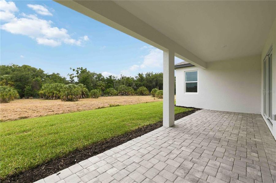 Exterior details and patio area of a home in Creeks Edge at Twin Rivers, Parrish (Image 28). Exterior details and patio area of a home in Creeks Edge at Twin Rivers, Parrish (Image 28).