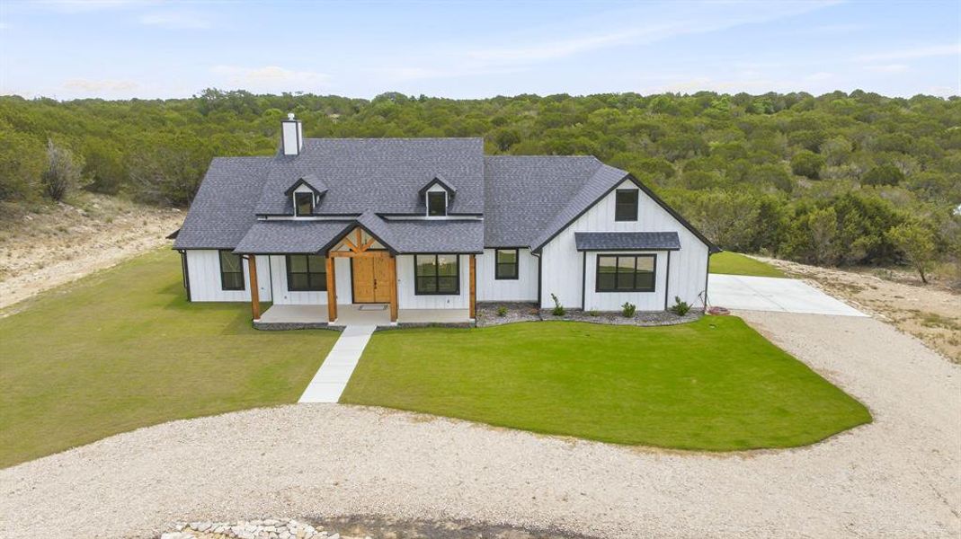 Front exterior of a new home in , Bluff Dale, TX, highlighting curb appeal (Image 19).