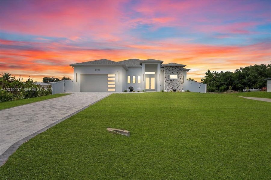 Front exterior of a new home in , Lehigh Acres, FL, highlighting curb appeal (Image 25). Front exterior of a new home in , Lehigh Acres, FL, highlighting curb appeal (Image 25).