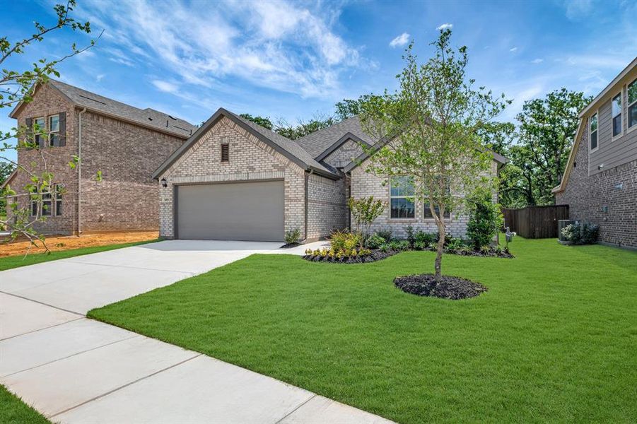 Front exterior of a new home in Kings Way, Denton, TX, highlighting curb appeal (Image 2). Front exterior of a new home in Kings Way, Denton, TX, highlighting curb appeal (Image 2).