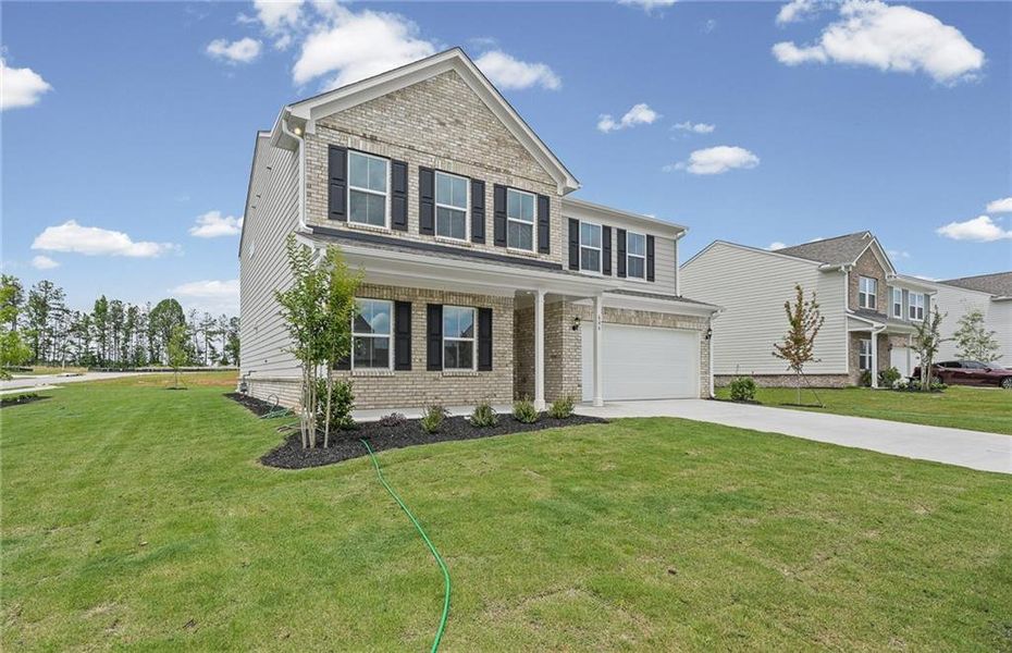 Front exterior of a new home in Anderson Point, McDonough, GA, highlighting curb appeal (Image 19). Front exterior of a new home in Anderson Point, McDonough, GA, highlighting curb appeal (Image 19).