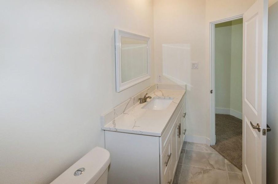 Bathroom featuring toilet and vanity