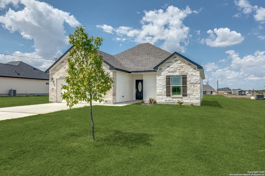 Front exterior of a new home in , Atascosa, TX, highlighting curb appeal (Image 23).