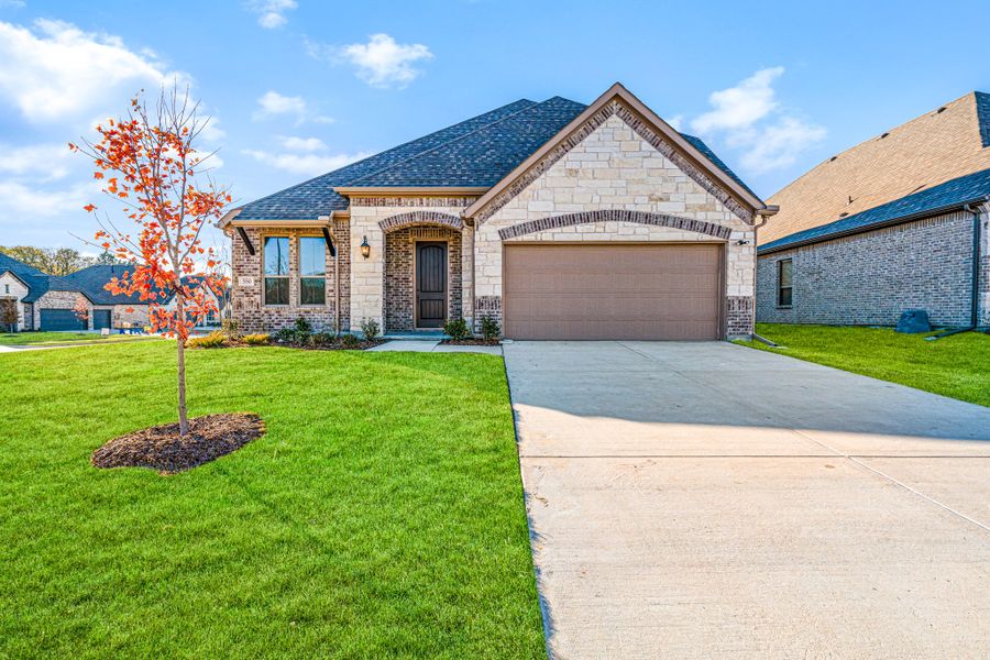 Front exterior of a new home in Forest Ridge Estates, Greenville, TX, highlighting curb appeal (Image 21).