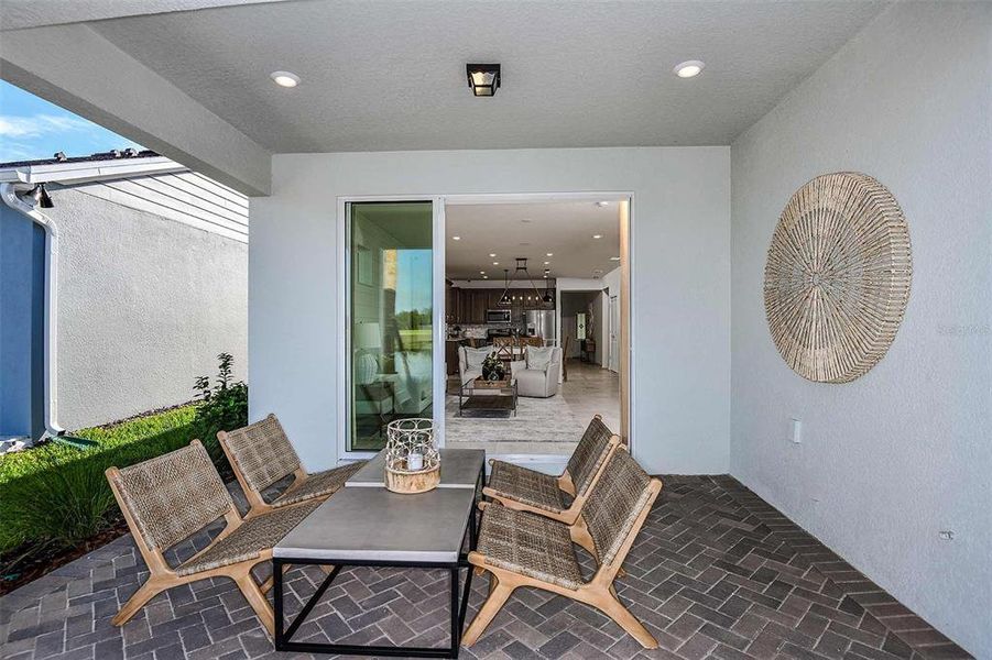 Exterior details and patio area of a home in Del Webb Sunbridge, St. Cloud (Image 21).