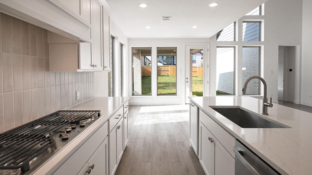 Furnished interior view inside a new home in 6 Creeks, Kyle (Image 9).