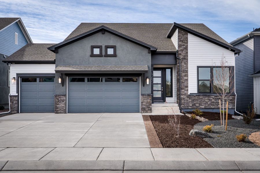 Front exterior of a new home in Cloverleaf - Pinnacle Collection, Monument, CO, highlighting curb appeal (Image 1). Front exterior of a new home in Cloverleaf - Pinnacle Collection, Monument, CO, highlighting curb appeal (Image 1).
