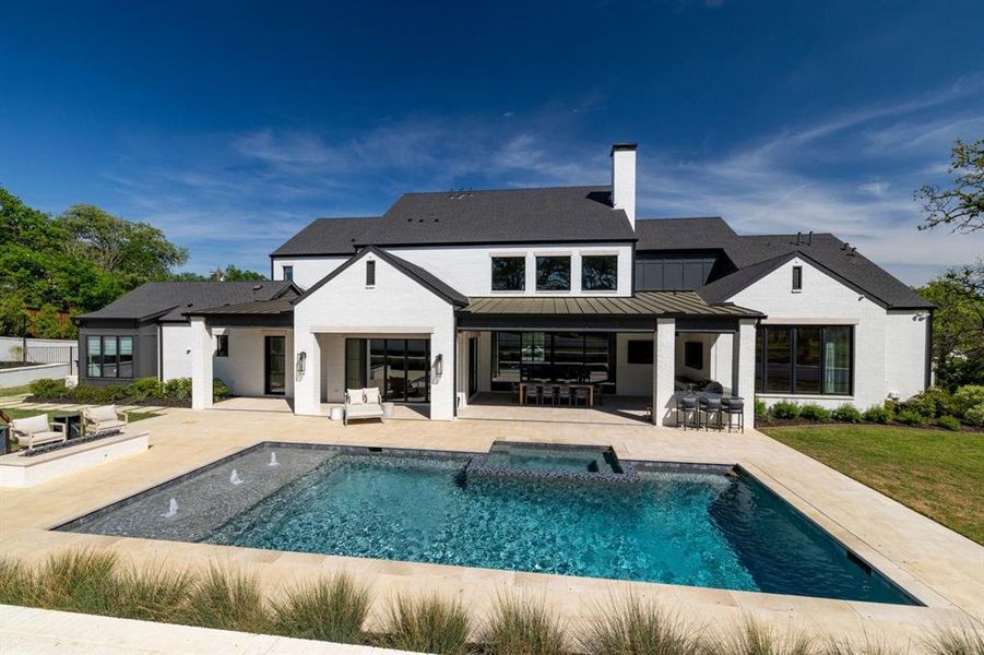 Pool, hot tub, firepit, outdoor kitchen... this yard has it all!