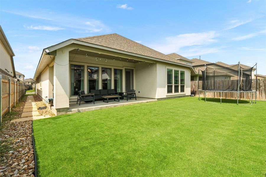 Front exterior of a new home in Santa Rita Ranch 50', Liberty Hill, TX, highlighting curb appeal (Image 20). Front exterior of a new home in Santa Rita Ranch 50', Liberty Hill, TX, highlighting curb appeal (Image 20).