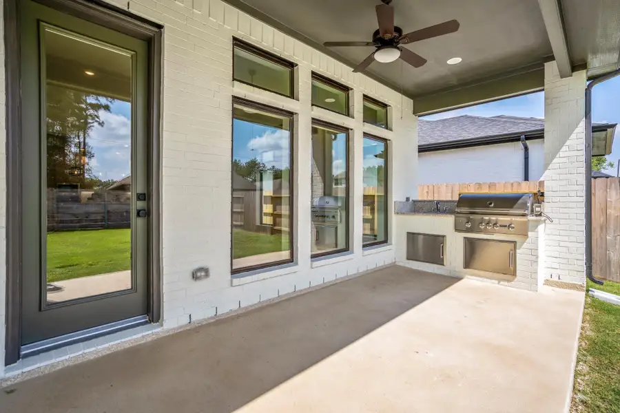 Exterior details and patio area of a home in ARTAVIA, Conroe (Image 3).
