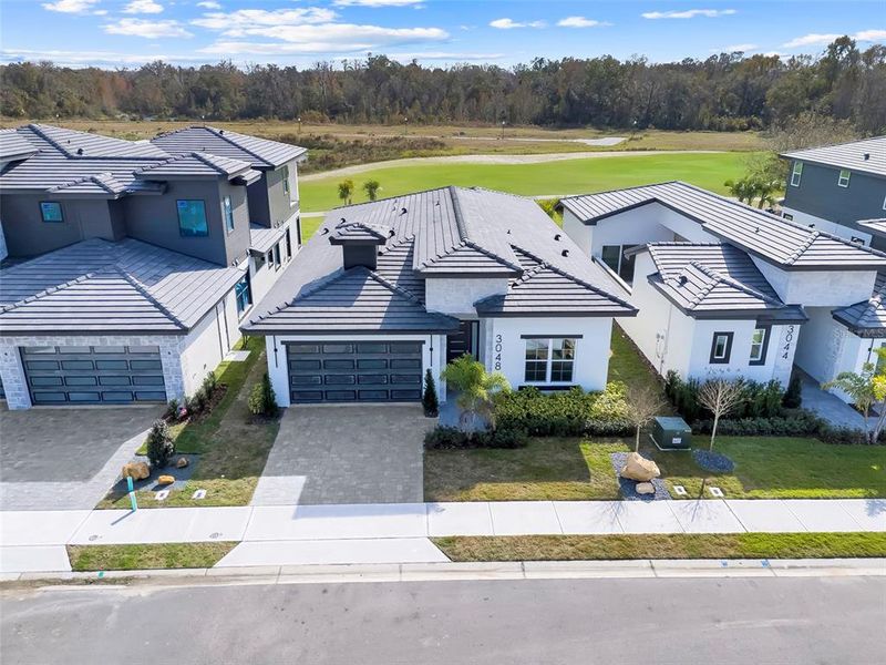 Front exterior of a new home in Hampton Green at Providence, Davenport, FL, highlighting curb appeal (Image 26).