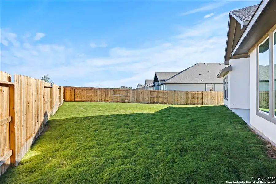 Exterior details and patio area of a home in Village at Three Oaks, Seguin (Image 4). Exterior details and patio area of a home in Village at Three Oaks, Seguin (Image 4).