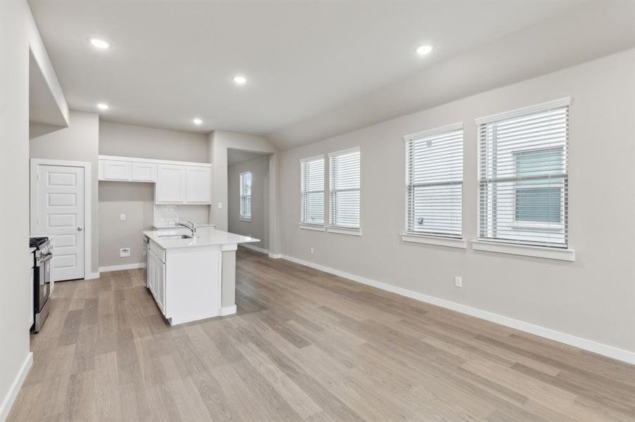 Open living space in in the Elm home plan by Trophy Signature Homes – REPRESENTATIVE PHOTO