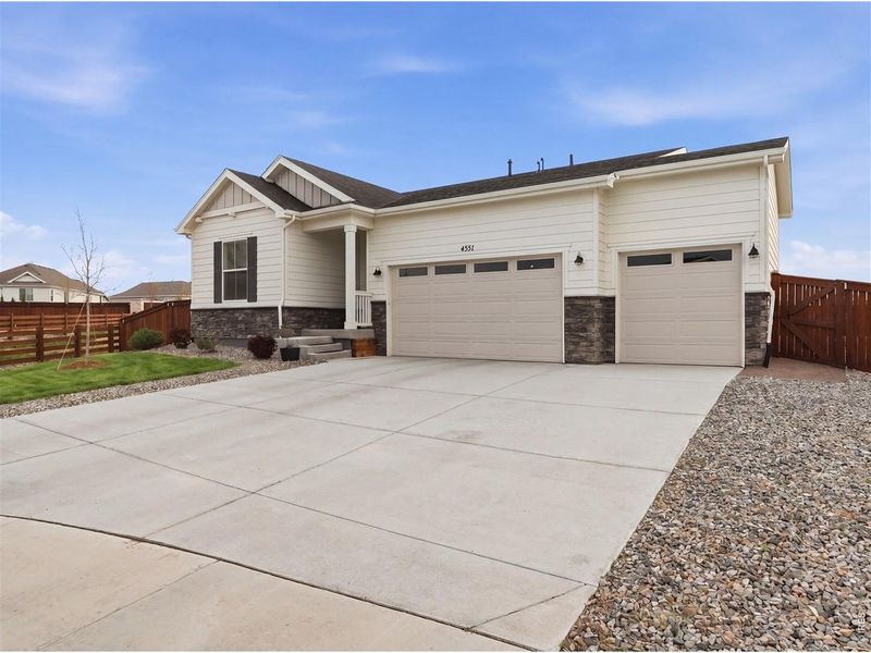 Front exterior of a new home in , Johnstown, CO, highlighting curb appeal (Image 22).