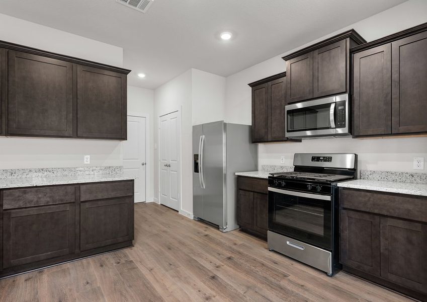 The kitchen has beautiful wood cabinetry. The kitchen has beautiful wood cabinetry.