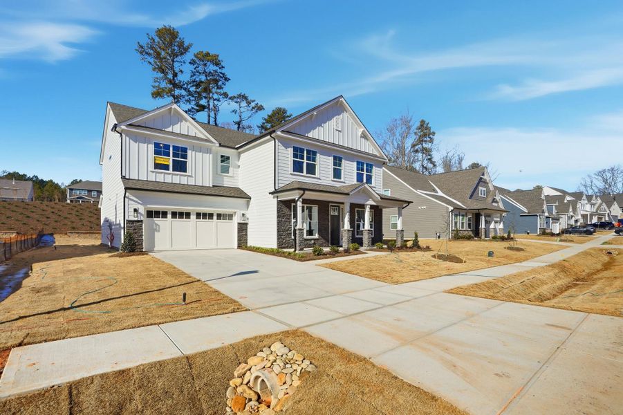 Front exterior of a new home in Rone Creek, Waxhaw, NC, highlighting curb appeal (Image 27).