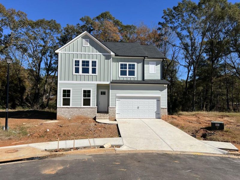 Front exterior of a new home in Red Bird Manor, Jefferson, GA, highlighting curb appeal (Image 1).