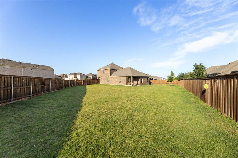 Exterior details and patio area of a home in Spiritas Ranch, Little Elm (Image 21). Exterior details and patio area of a home in Spiritas Ranch, Little Elm (Image 21).