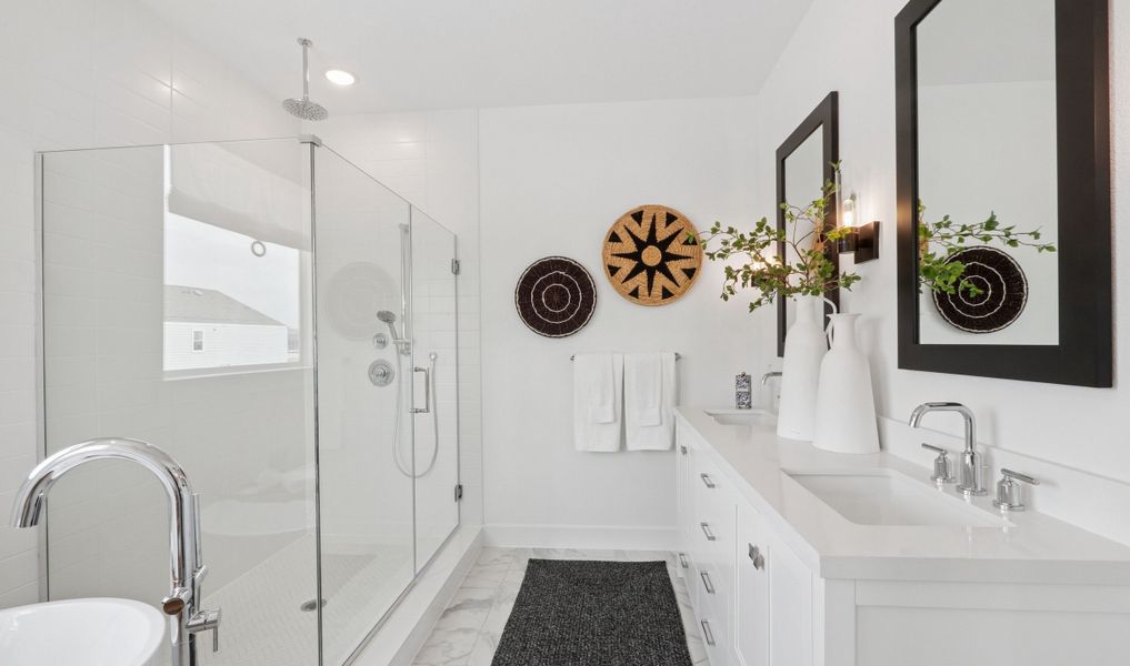 Primary bath with glass shower enclosure & chrome hardware Primary bath with glass shower enclosure & chrome hardware