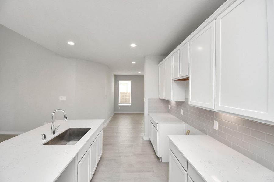 This generously spacious kitchen is a dream realized! Sample photo of completed home with similar floor plan. Actual colors and selections may vary.