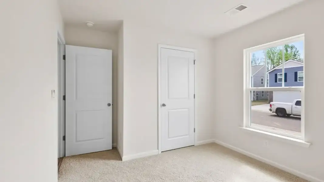 Spacious, unfurnished interior of a new home in Village Grove, Greenville (Image 17).