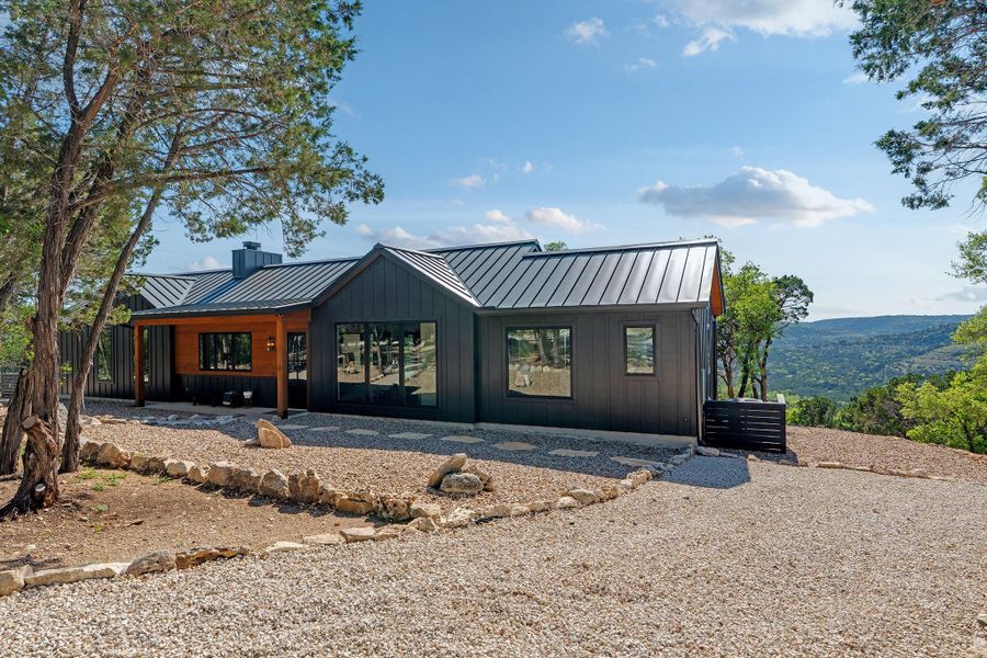 This is a TO BE BUILT custom home on 6.75 acres in Rainbow Ranch, Wimberley TX.  Views will be similar.