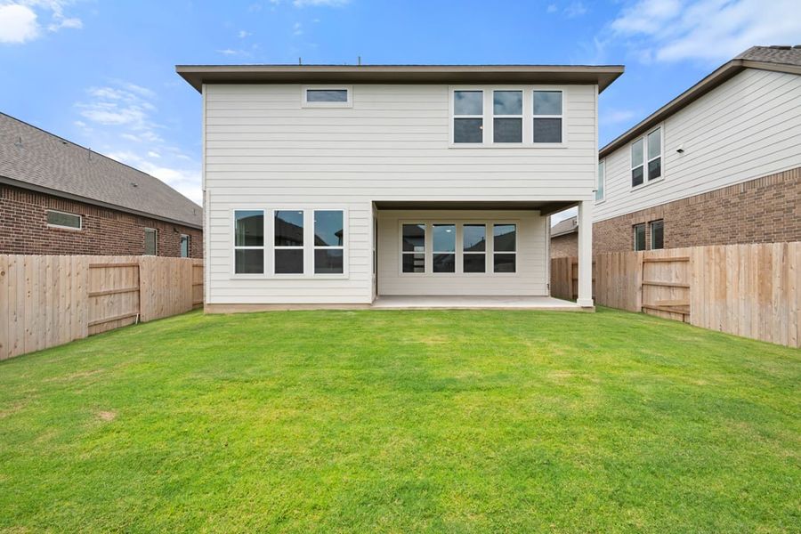 Front exterior of a new home in Arbor Collection at Lariat, Liberty Hill, TX, highlighting curb appeal (Image 25). Front exterior of a new home in Arbor Collection at Lariat, Liberty Hill, TX, highlighting curb appeal (Image 25).