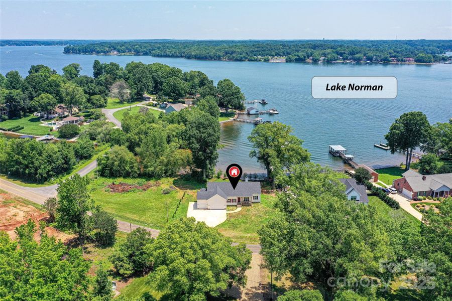 Waterfront, Custom Designed Home with 3 Bedroom, 2.5 Bath, Ranch & 3 Car Garage, with views of Lake from front & back of home, located on Kiser Island with NO HOA!