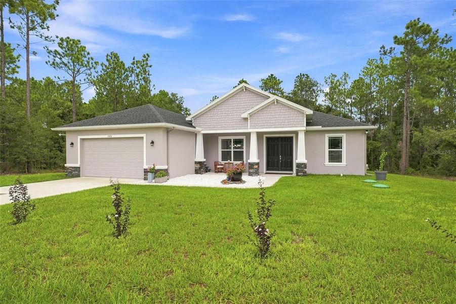 Front exterior of a new home in , Weeki Wachee, FL, highlighting curb appeal (Image 2). Front exterior of a new home in , Weeki Wachee, FL, highlighting curb appeal (Image 2).