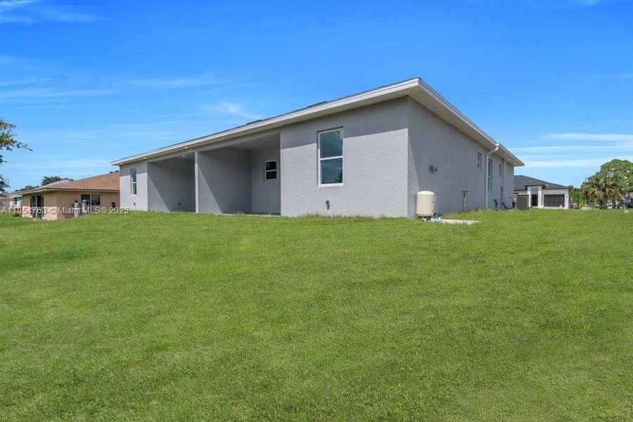Front exterior of a new home in , Lehigh Acres, FL, highlighting curb appeal (Image 29).