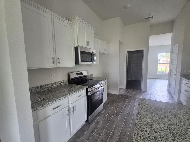 Furnished interior view inside a new home in Hill Country Estates, Dade City (Image 44).