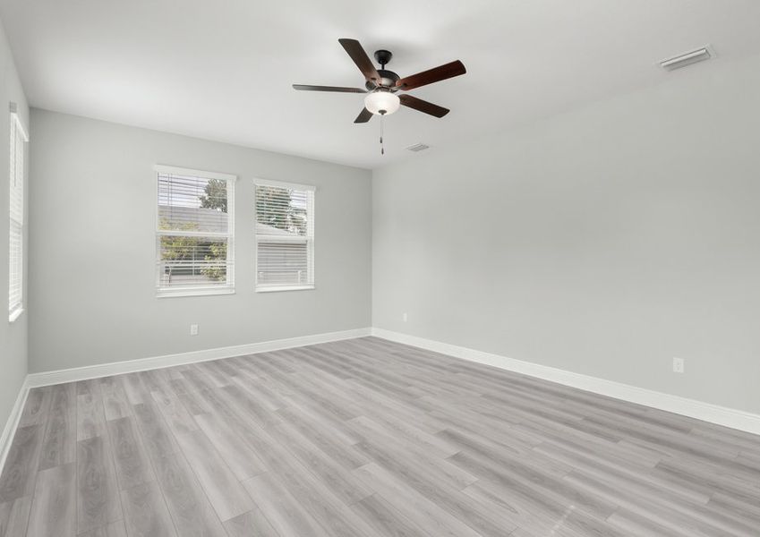 This master bedroom has ample natural light and space for your king-sized funiture