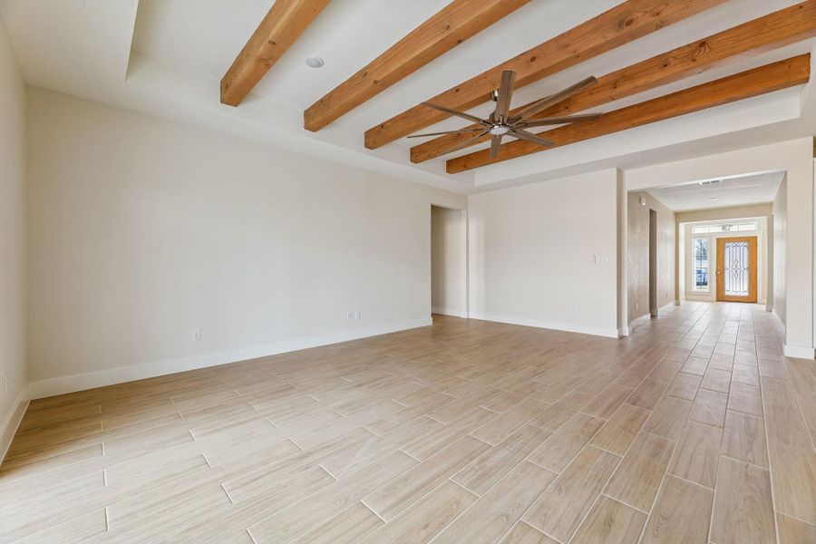 Living room with hallway to front door.