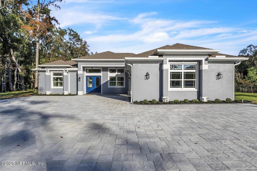 Front exterior of a new home in , Hastings, FL, highlighting curb appeal (Image 1).