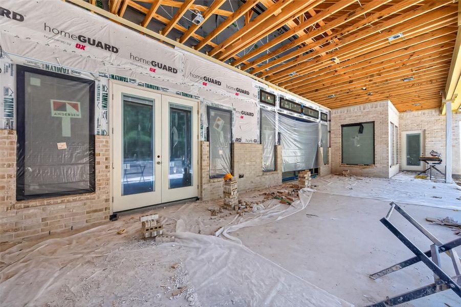 View of the covered patio leading to the primary bedroom