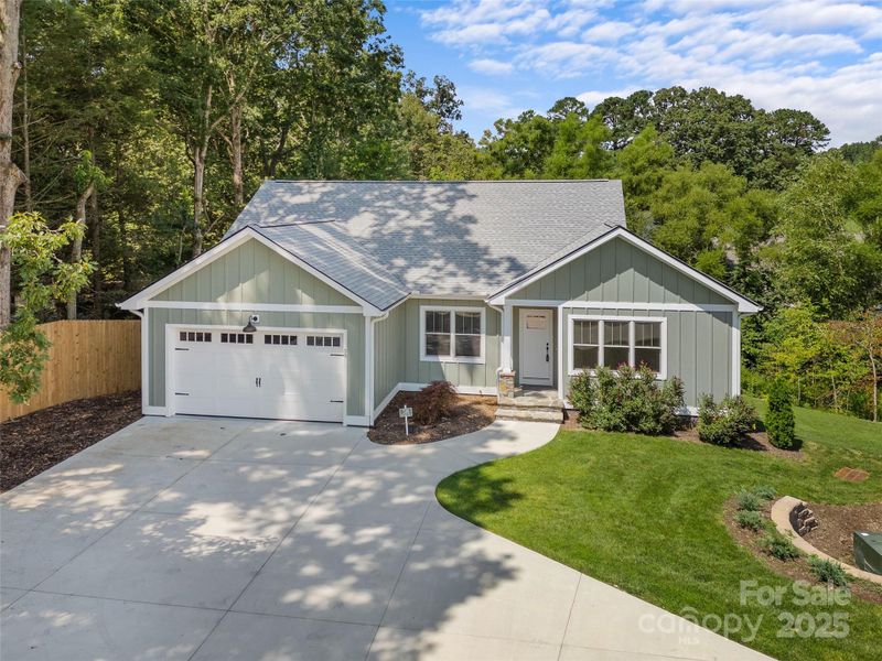 Front exterior of a new home in , Hendersonville, NC, highlighting curb appeal (Image 23).