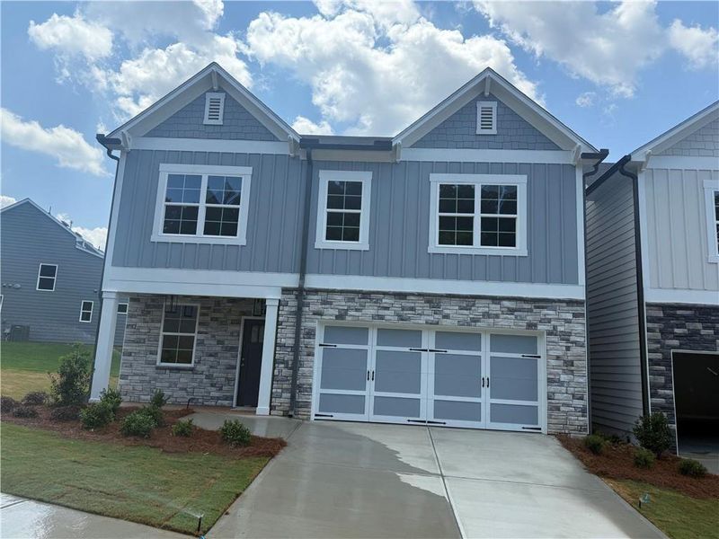 Front exterior of a new home in , Canton, GA, highlighting curb appeal (Image 2). Front exterior of a new home in , Canton, GA, highlighting curb appeal (Image 2).